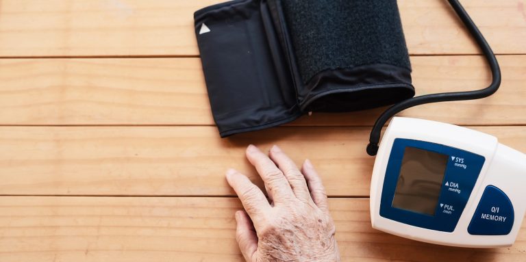 Old lady is being checked blood pressure using blood pressure monitor kid set - people with health care medical instrument set concept